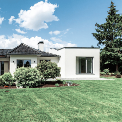 A house with freshly mowed lawn and landscaped beds